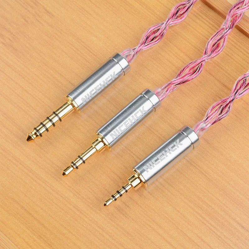 Black German pure copper headphone cable with 3.5mm angled plug and MMCX connectors on a light background