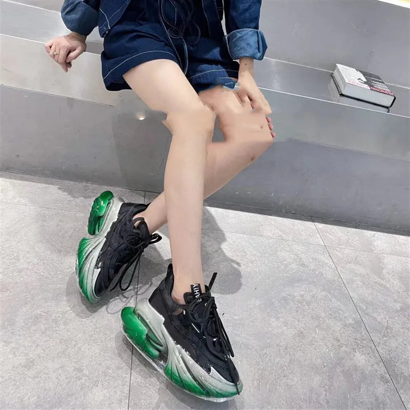 Women's black leather high-top sports shoes with a thick platform sole and jelly-strap detail.