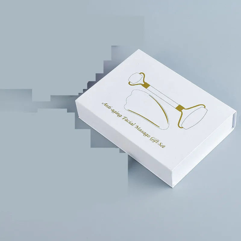 White jade double-headed roller and scraping board set for facial and body massage.