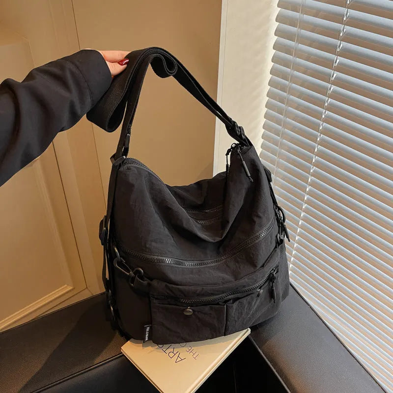 Women's soft nylon crossbody bag in square vertical shape with dual shoulder straps