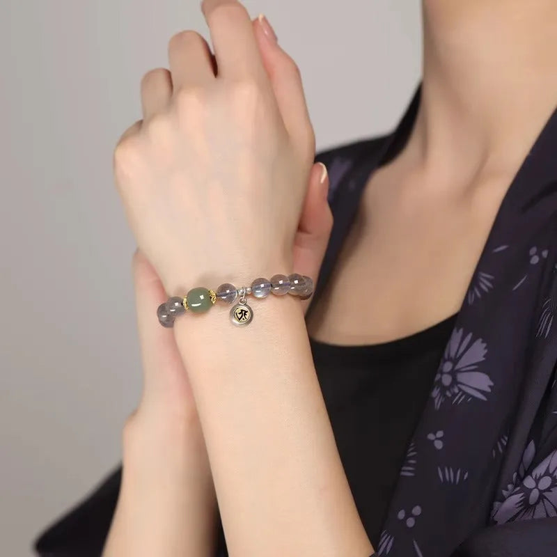 Moonstone women's bracelet with 8mm beads showing Thousand-Hand Guanyin Mouse zodiac design