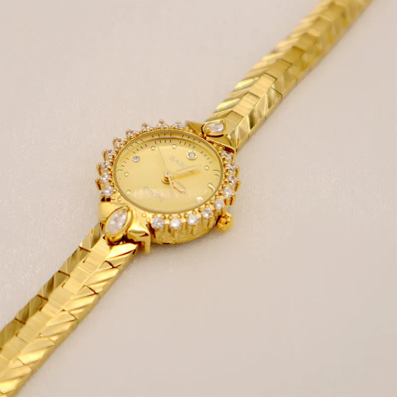 Women's quartz watch with diamond-textured metal bracelet and slim 6mm gold-tone case