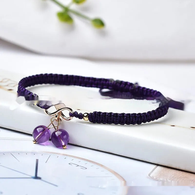 Women's Natural Strawberry Quartz bracelet with fruit-shaped cherry beads on a wrist.
