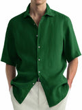 Men's green washed cotton casual cardigan shirt laid flat, showing regular fit and button front.