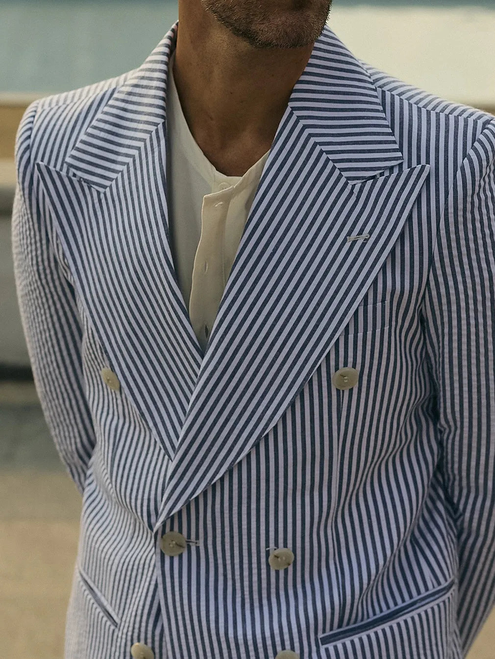 Men's blue and white striped polyester suit set with blazer and trousers