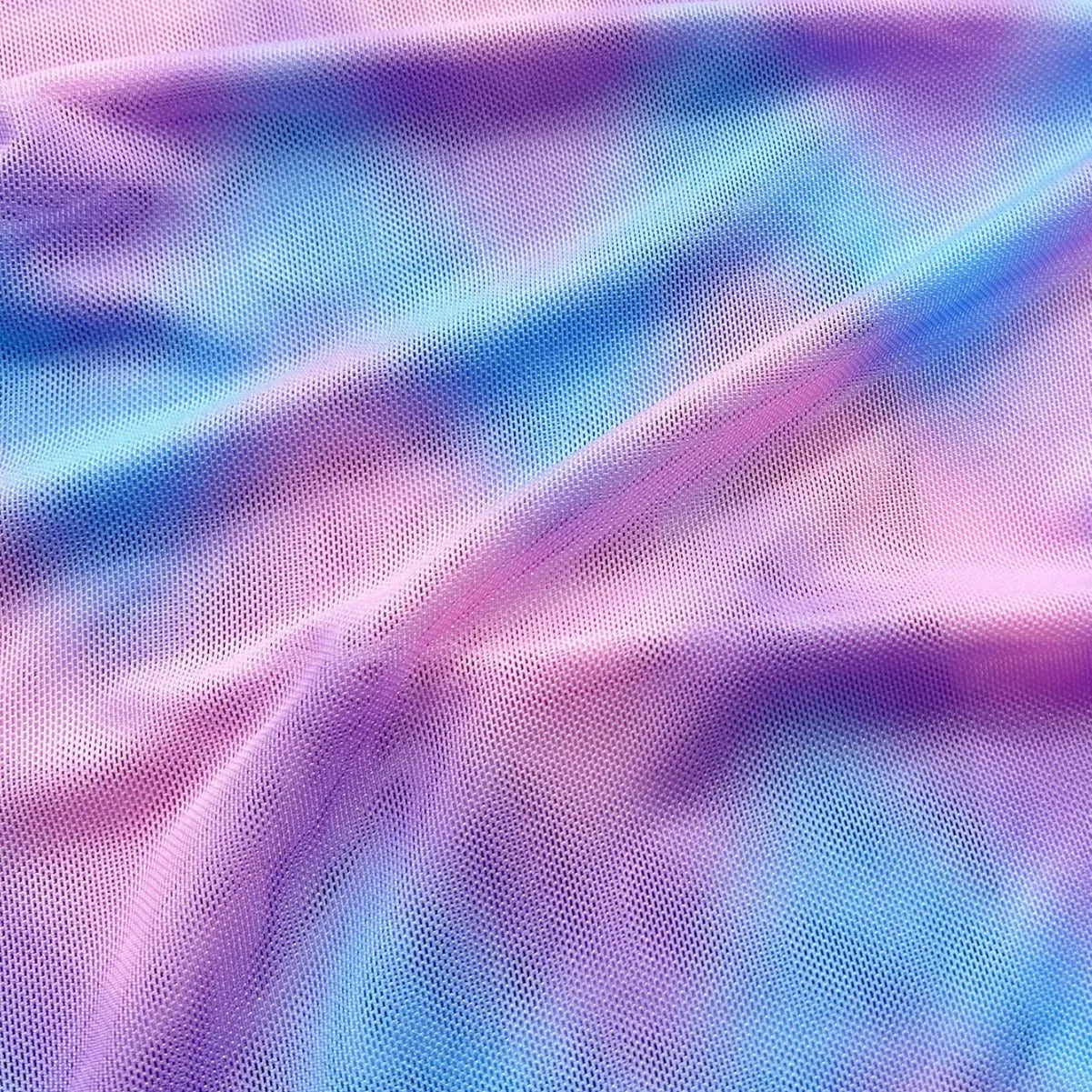 Women's split tie-dye bikini swimsuit set with matching skirt on mannequin