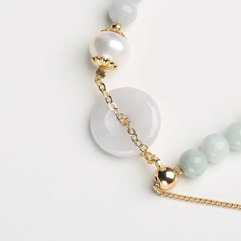 National style jade and pearl bracelet for women with a geometric peace buckle charm.
