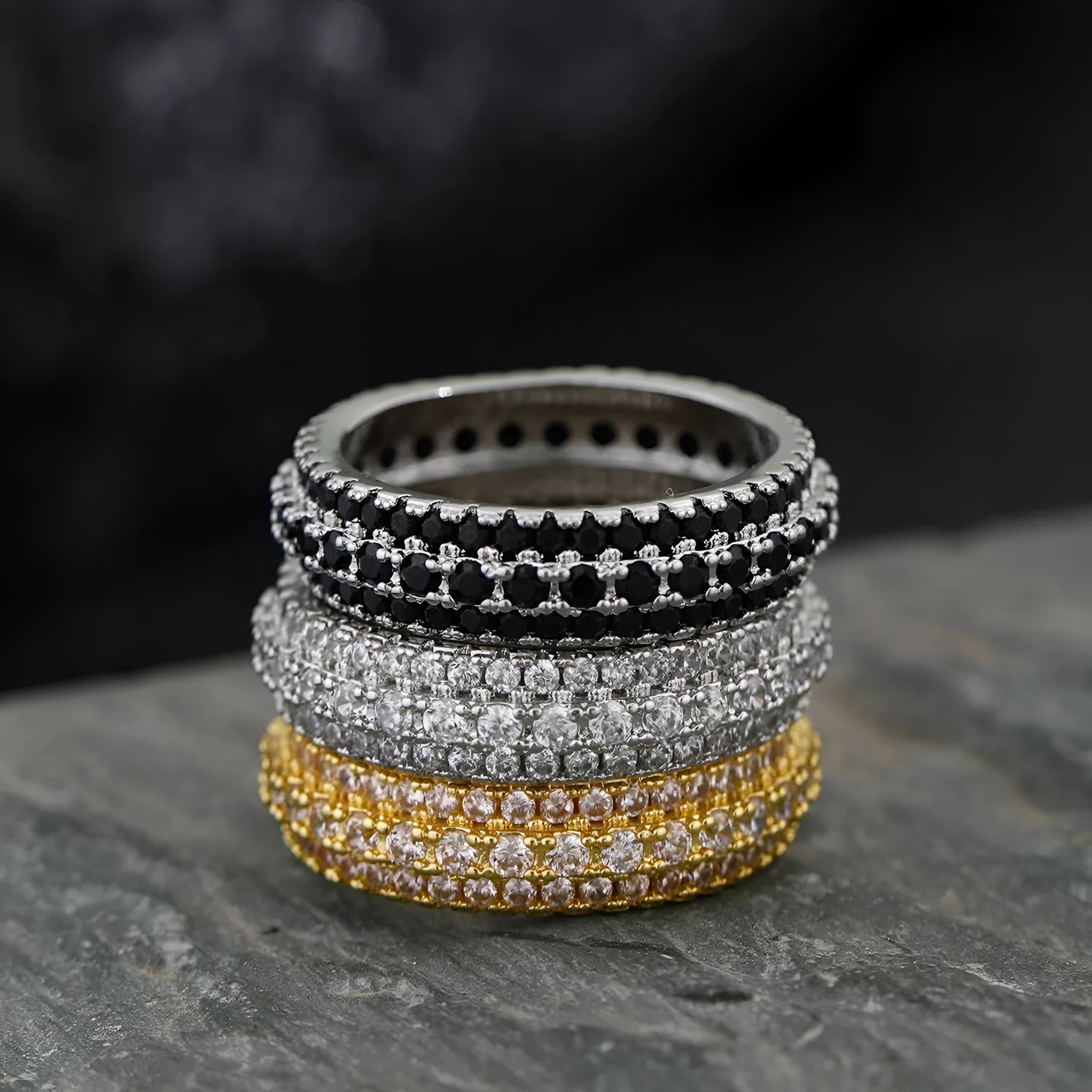 Geometric triangle ring with a zircon stone in a copper band, shown in white gold finish.
