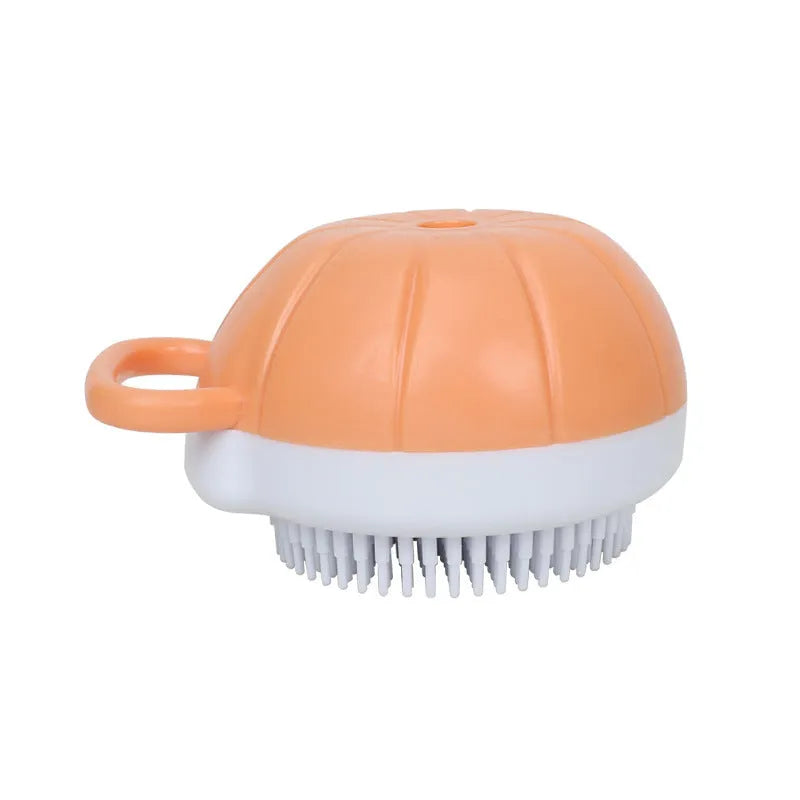 Orange TPR dog bath brush with shampoo dispenser and curved pumpkin grip design