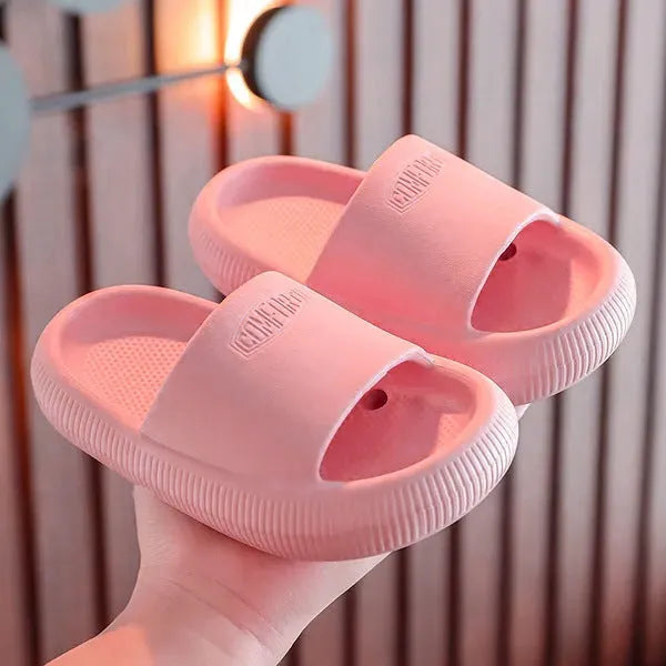 Children's colourful EVA slippers with a textured non-slip sole, shown in a mixed colour selection.