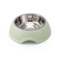 Blue stainless steel pet bowl with a non-slip base for cats and dogs on a floor.
