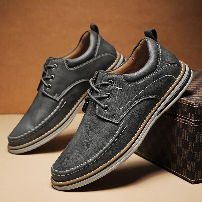 Men's genuine leather casual shoes in black with round toe and lace-up design on rubber sole