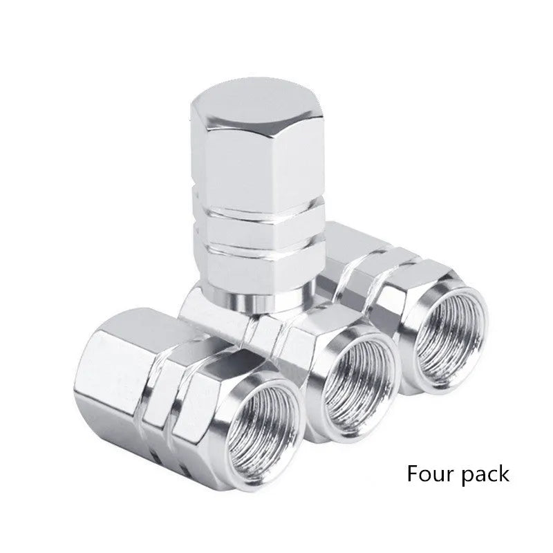 Set of five aluminium alloy car valve caps in black, blue, gold, red, and silver, designed for tyre valve stems with screw-on threading.