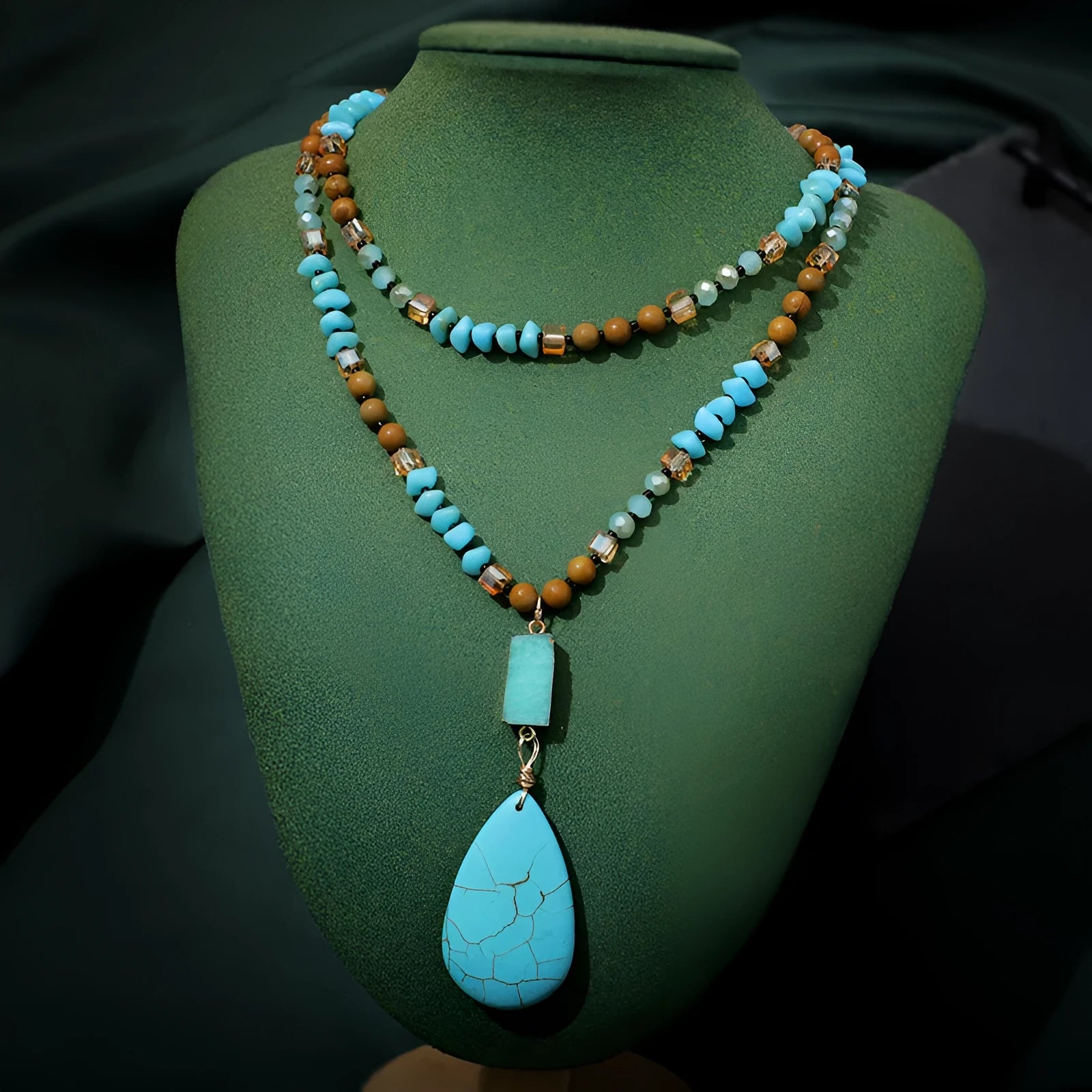 Blue turquoise heart and water drop shape pendant necklace with mixed gem inlay on a ball bead chain.