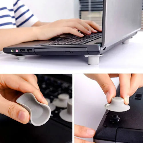 Four grey plastic laptop cooling pads with silicone feet, two large and two small, on a wooden desk.