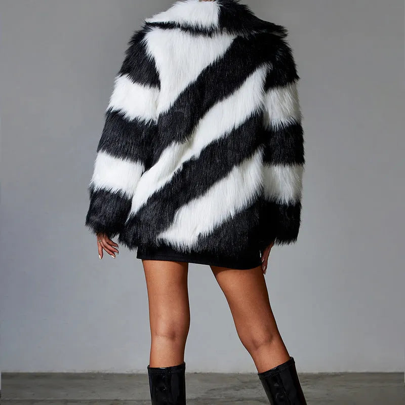 Minimalist faux fur coat with a contrasting colour lapel and a fur collar.