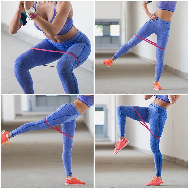 Five pink gradient latex yoga tension bands laid flat showing increasing resistance levels from light pink to rose red