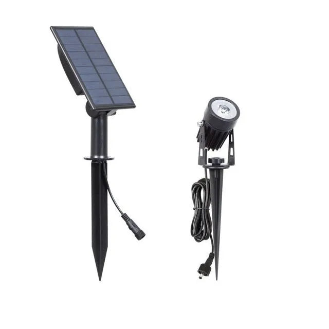 Solar lawn lamp with aluminium frame and white LED panel on grass