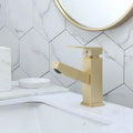 Square pull-action faucet in brushed gold finish for kitchen or bathroom sink.