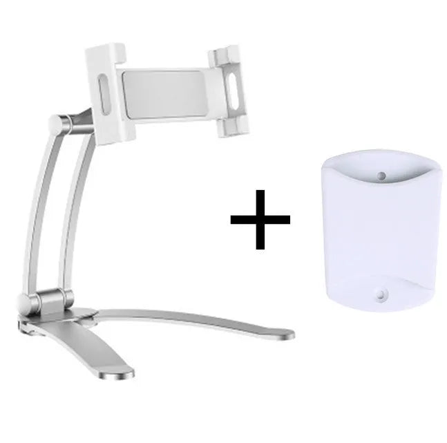 Silver aluminium alloy desktop tablet stand with adjustable clips and 360-degree rotation on a white mount.