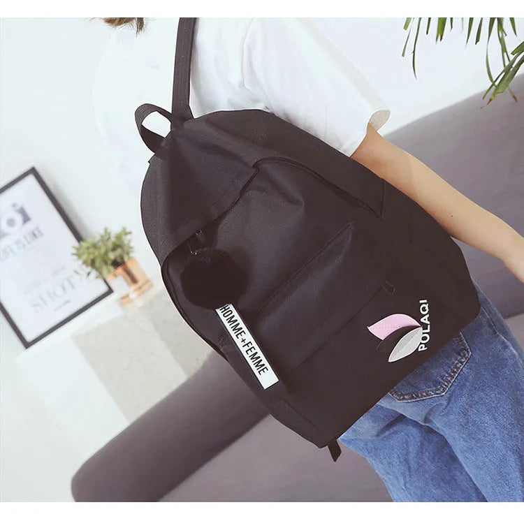 Canvas college backpack with leaf pattern in green colour showing front compartment and straps