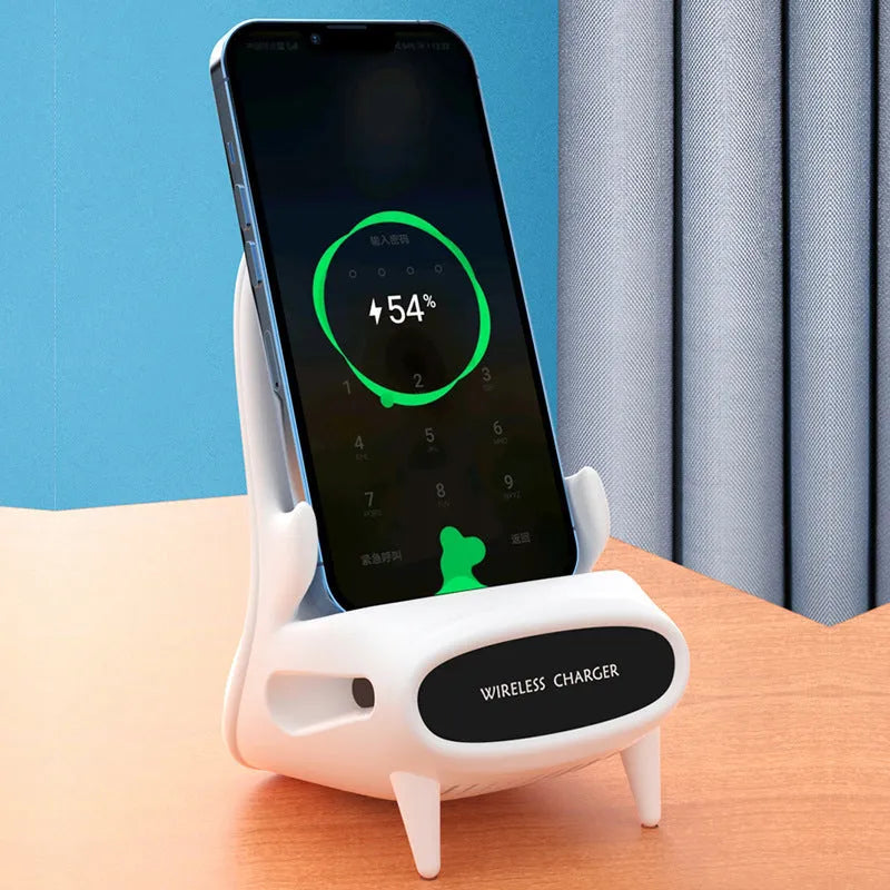 White mini chair-shaped wireless charging stand holding a mobile phone at an angle.