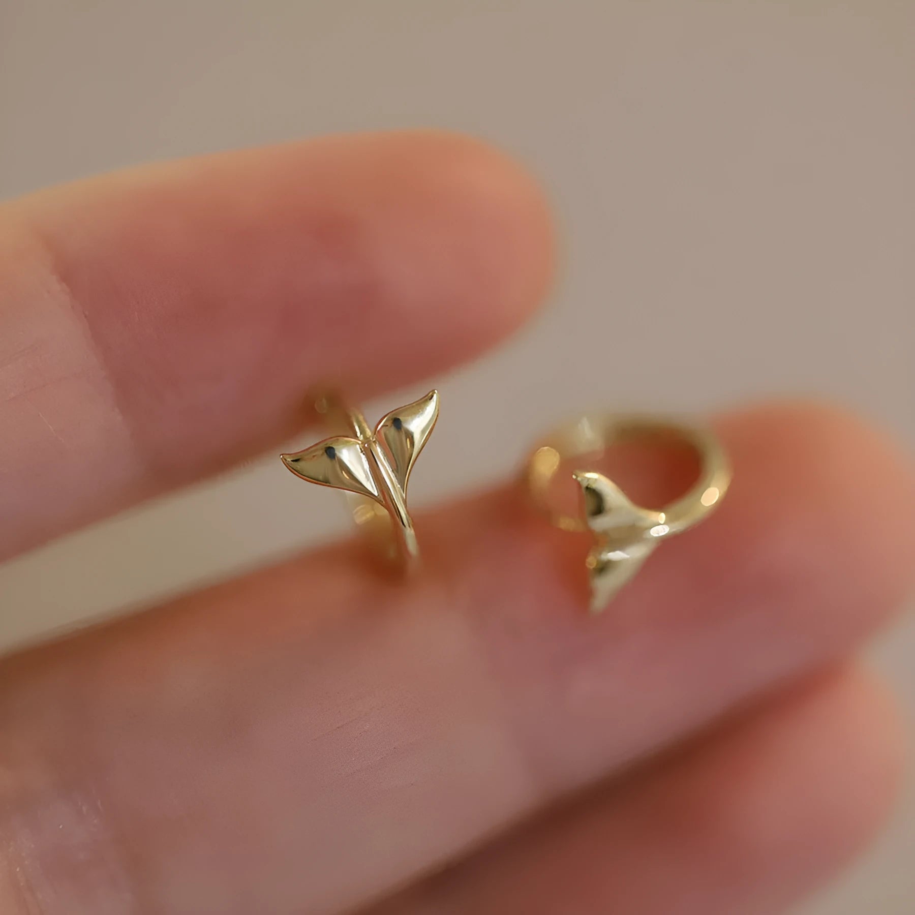 Sterling silver fishtail earrings with gold plating showing 8mm hoop size