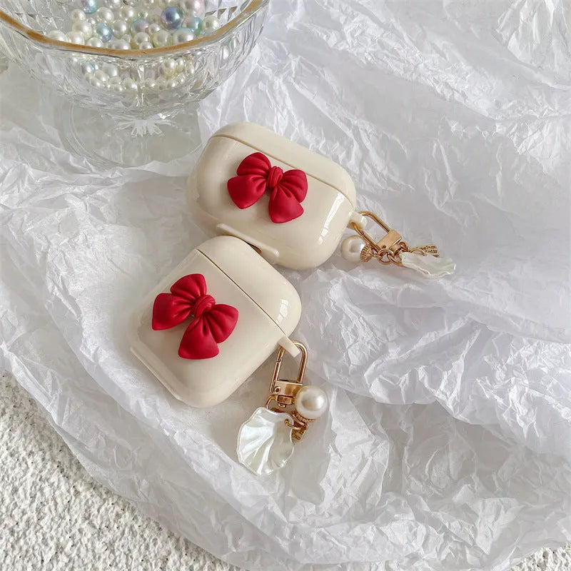 Beige TPU case with a red bow for AirPods and AirPods Pro wireless earphones