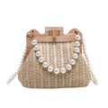 Women's woven straw shoulder bag with pearl chain strap showing internal organisation compartments