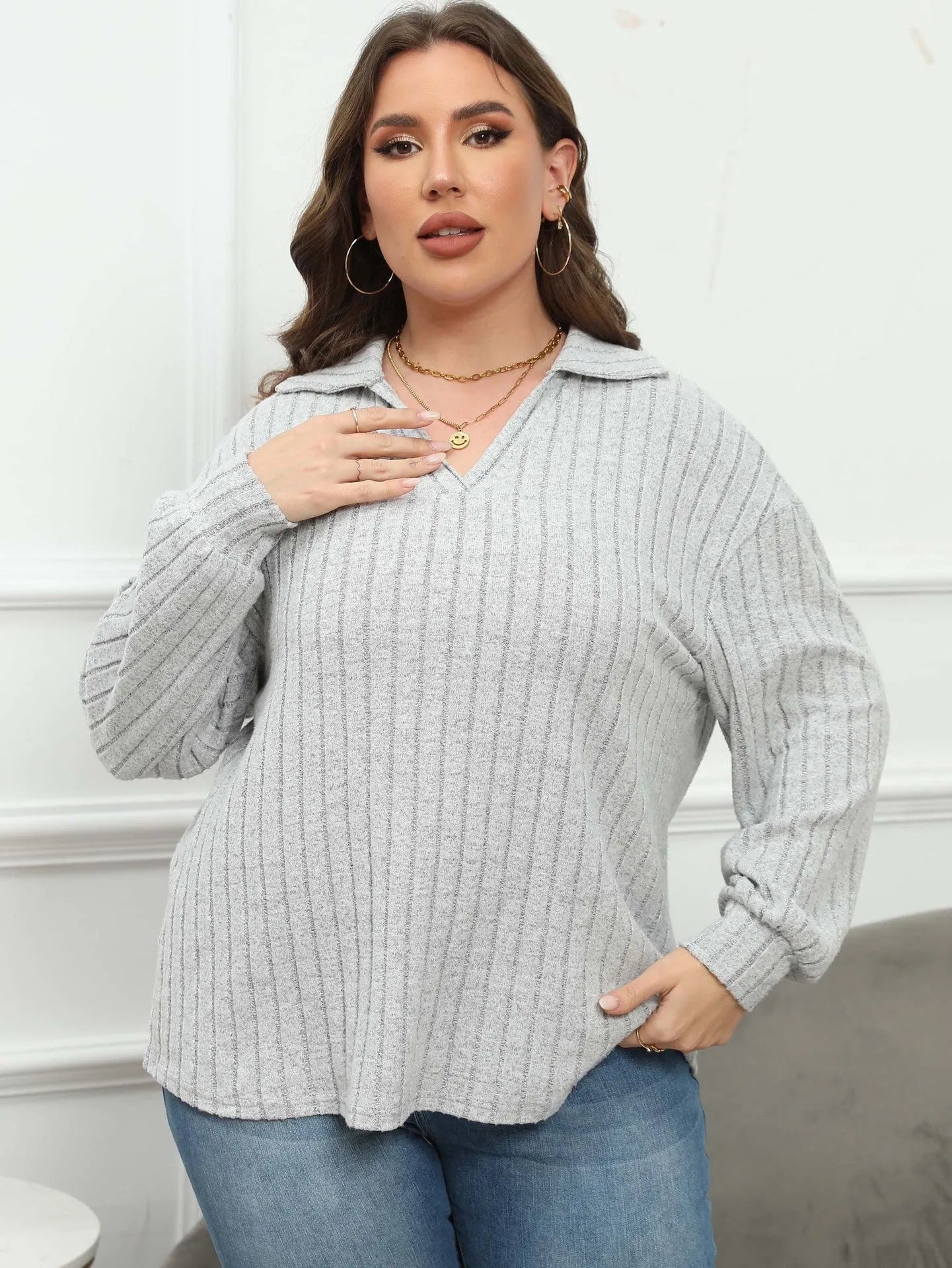 Women's plus size grey polo collar blouse with lantern sleeves made from polar fleece fabric.