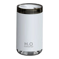 Blue jellyfish USB humidifier with night light on wooden table, showing mist output