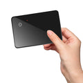 Black pet tracking card with wireless charging, 85mm by 54mm dimensions and hanging hole for collar attachment