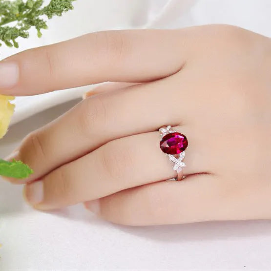 Women's heart-shaped butterfly ring in 18k rose gold plating with red or blue enamel option.