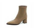 Women's khaki stretch suede pointed-toe boots with a wedge heel on a mid-calf.