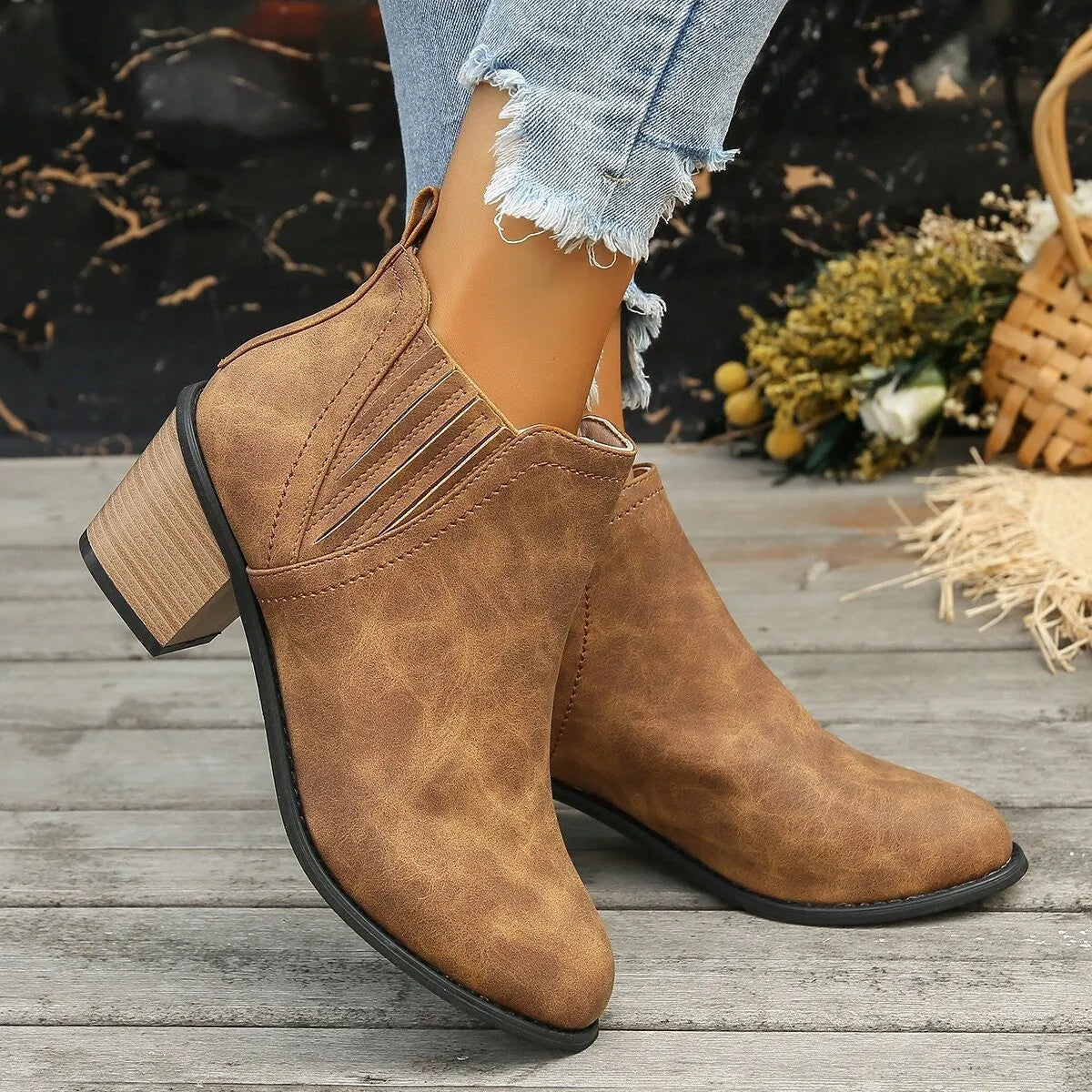 Women's black ankle boots with pointed toe and thick square heel, slip-on design
