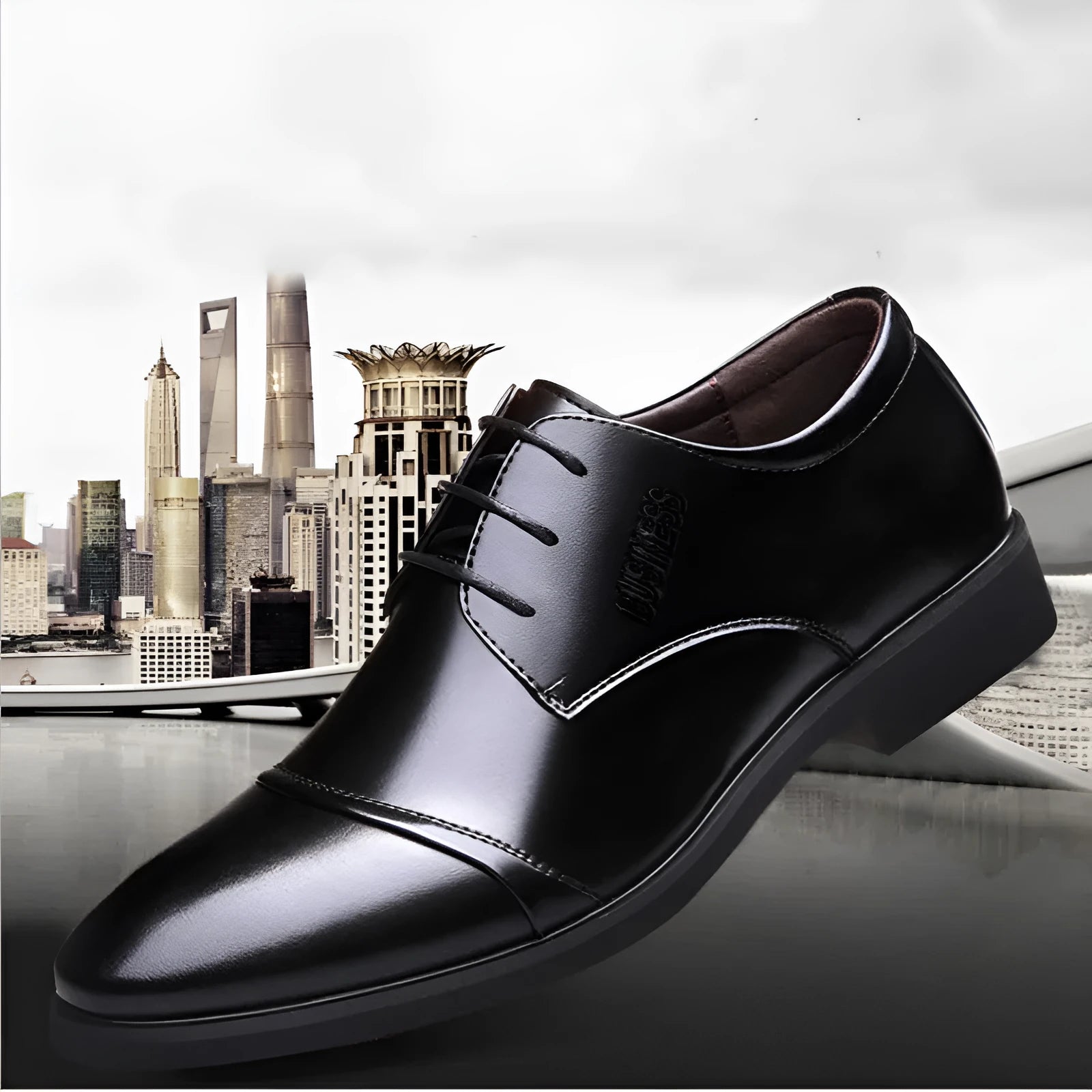 Men's black PU leather lace-up boot with stitching detail and a rubber sole on a neutral background