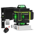Rotating laser level with green laser projection and orange wall stickers on measurement surface