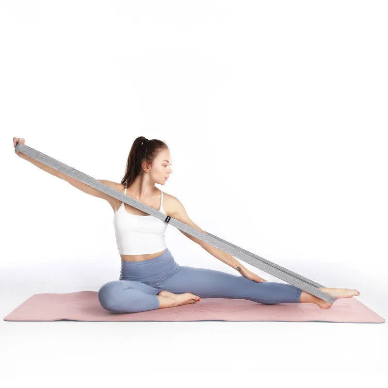 Three polyester cotton and latex silk resistance bands 200 x 4 cm in blue pink and purple on a flat surface