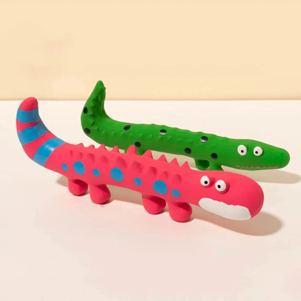 Green cartoon lizard-shaped dog chew toy with squeaker on a white background.