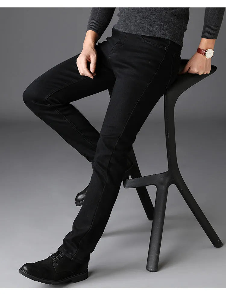 Men's slim straight black denim jeans with mid waist, zip fly and water-washed finish, sizes 28-40