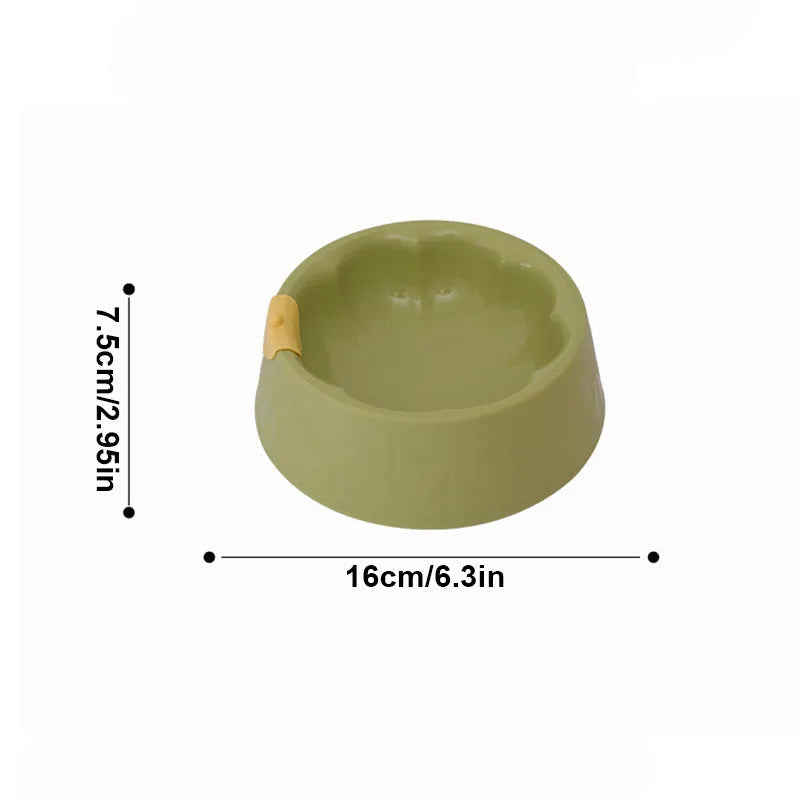 Green plastic flower-shaped double pet bowl for dog and cat food and water.