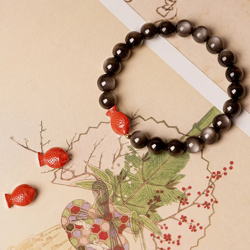 Natural obsidian and cinnabar round bead bracelet shown in three size options.