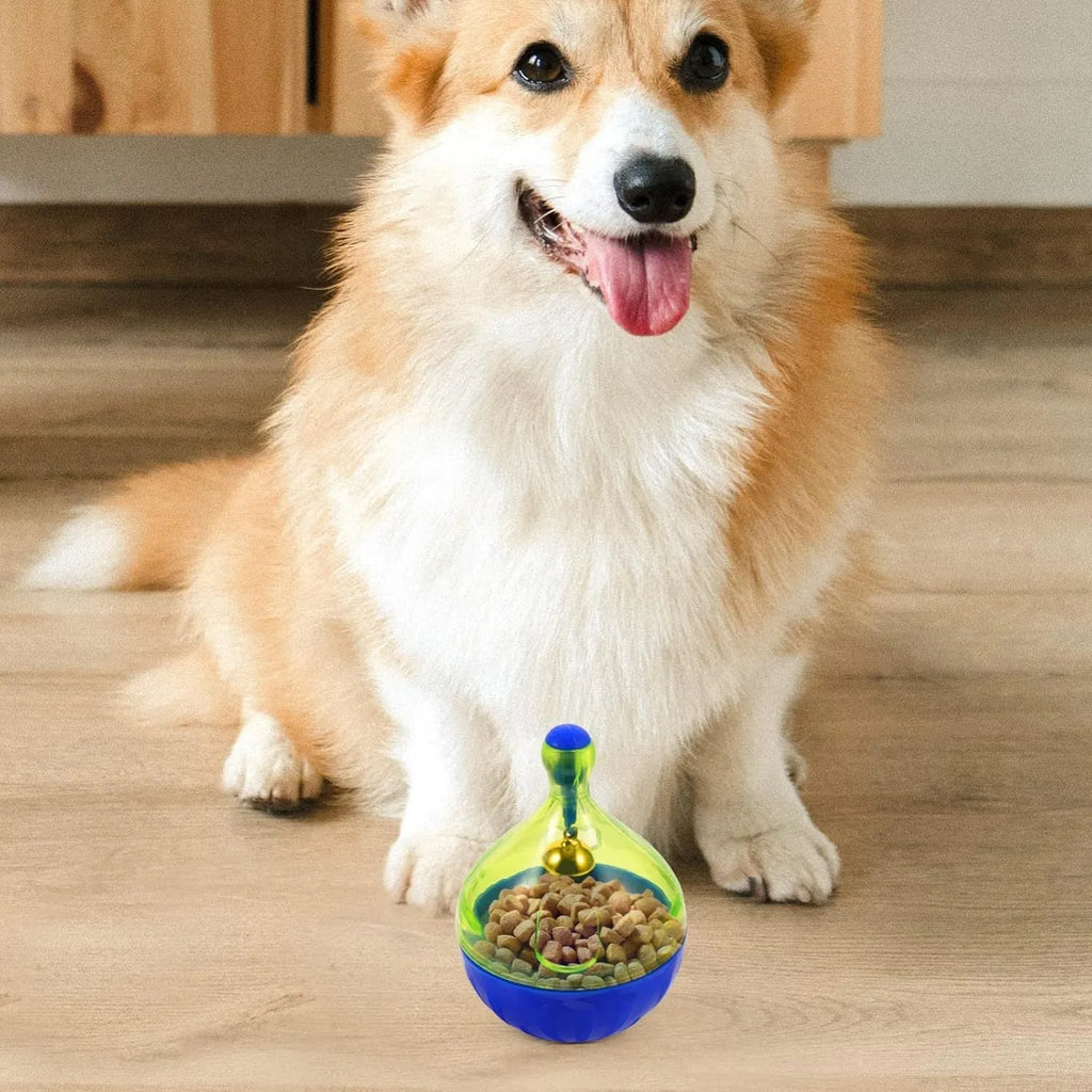 Blue and white tumbler-shaped interactive treat dispenser toy for dogs and cats on a wooden floor.