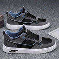 Men's low-top canvas board shoes in grey with leather stitching detail on a white background.