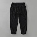 Man wearing loose straight-leg casual trousers in a cotton linen blend, showcasing the retro Japanese style.