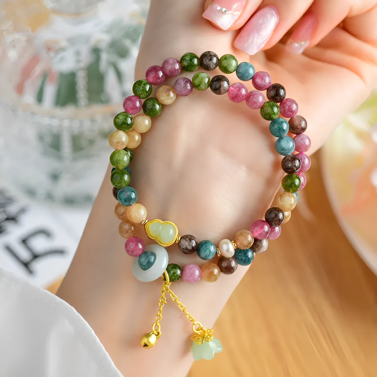 Close-up of a women's double ring bracelet made from round natural chalcedony crystal beads.