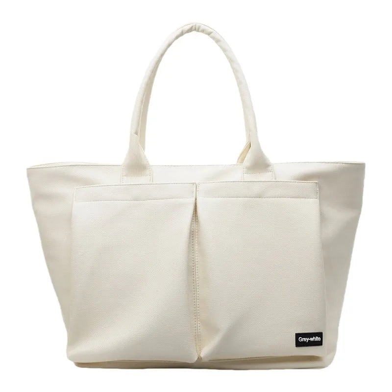 Sporty simplicity shoulder bag in solid colour with expandable 20-35L capacity