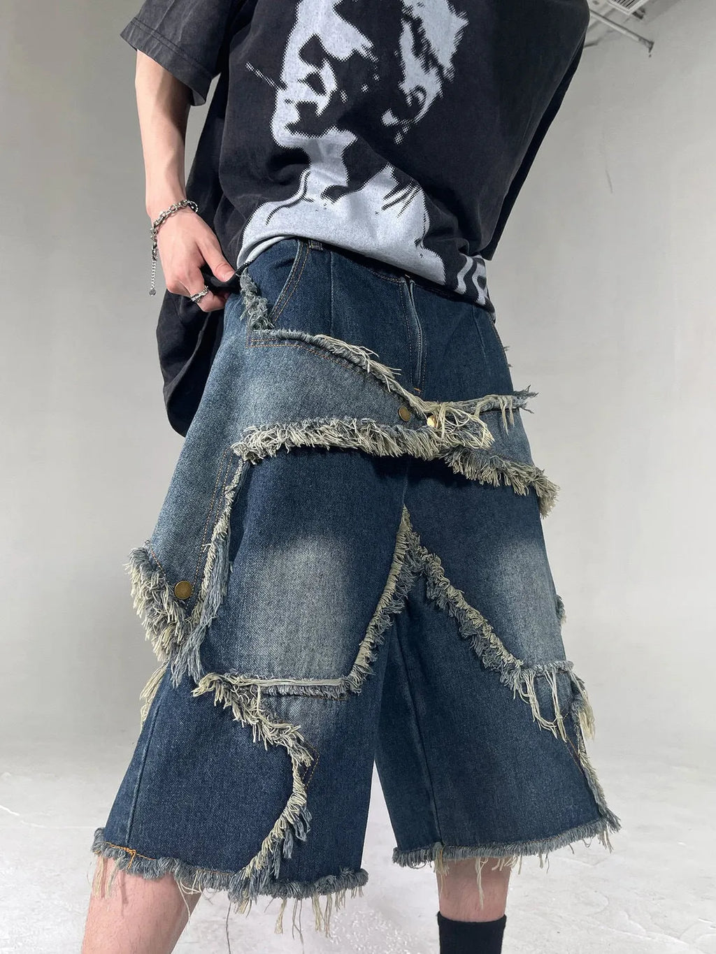Blue retro denim shorts with frayed five-pointed star detail and loose fit design
