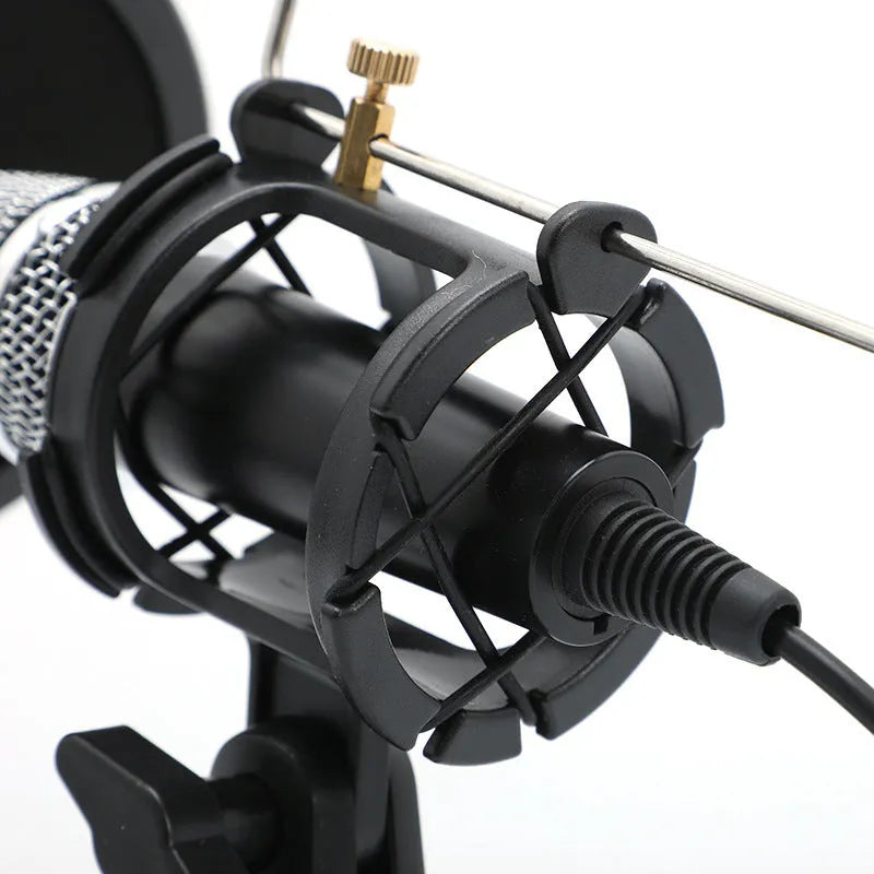 Black or silver condenser microphone on aluminium stand with 3.5mm and USB cables for mobile phone and computer broadcasting
