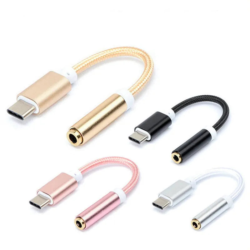 Nylon-woven Type-C to 3.5mm female headphone adapter cable in black, shown next to a smartphone.